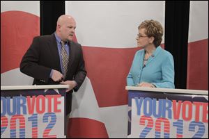 Republican challenger Samuel Wurzelbacher and Rep. Marcy Kaptur (D., Toledo) talk after a recent debate.