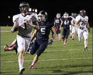 Perrysburg’s Steve Slocum scores against Napoleon. The senior leads the team with 1,261 yards rushing and has 1,183 yards passing. He’s made 46 of 46 extra-point kicks.