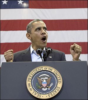 President Obama urges supporters at a rally at the University of Cincinnati to move ‘forward’ with him. About 13,500 turned out for the event Sunday.