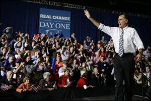 Mitt Romney walks out on stage as he campaigns at Iowa Events Center, in Des Moines.