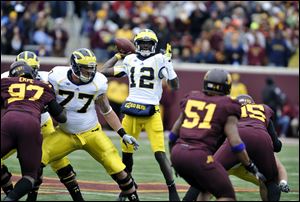 Michigan's Devin Gardner during an NCAA college football game against Minnesota, Saturday, Nov. 3, 2012, in Minneapolis. (AP Photo/Tom Olmscheid)