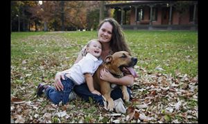 Carrisa Curry, shown with her son Kaleb Smart, 2, is appealing the Lucas County dog warden's designation of her dog Duke as dangerous.