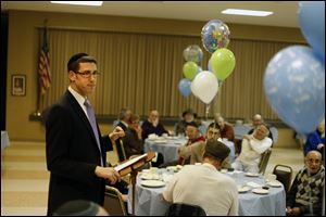 Rabbi Jonathan Bienenfeld thanks everyone for attending his 8-day-old son's naming and circumcision ceremony at Congregation Etz Chayim in Toledo.