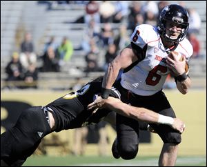 Northern Illinois quarterback Jordan Lynch leads the country in rushing yards this season. The Mid-American West division title will be in the balance for the winner between NIU and Toledo next week.