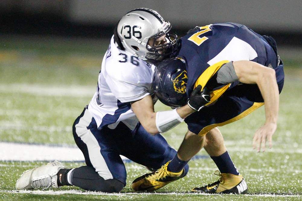 Whitmer-football-Holley-sacked