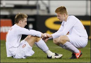 Sylvania Southview's Brad Brown (7) and Chris Ellis (16) react to the loss after the match.