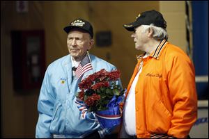 Korean War Veteran Henry Bahler, left, talks with Vietnam Veteran Attison Digby after the Veterans Appreciation Breakfast and Resource Fair in Savage Arena at the University of Toledo.