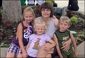 Sandy Ford  is pictured with her grandchildren, from left, Paige, Madalyn, and Logan Hayes.