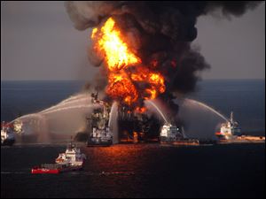 The U.S. Coast Guard, fire boat response crews battle the blazing remnants of the off shore oil rig Deepwater Horizon. 