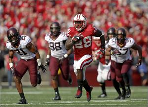 Wisconsin senior running back Montee Ball (28) needs just two trips to the end zone to become the all-time FBS career touchdowns leader.