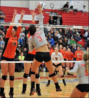 Owens' Alyssa Meis, a Genoa High School alumna, attempts one of her 15 kills Friday night as the the Express lost to No. 1 Cowley County in the NJCAA Division II semifinal.