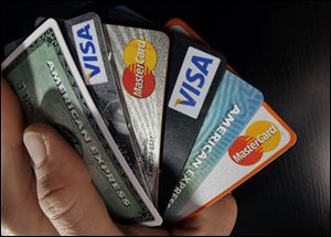 Americans cranked up their use of credit cards in the third quarter, racking up more debt than a year ago, while also being less diligent about making payments on time, an analysis of consumer-credit data shows.