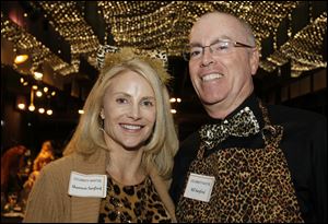 Celebrity waiters Shannon and Bill Sanford are dressed for the venue at Victory Center's Wait Night at the Toledo Zoo.