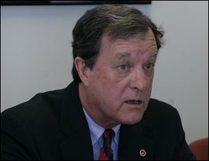 From left;  James Seney, former Sylvania mayor, and attorney James Tuschman, talk about transportation project. Mr. Seney was killed in a boating accident in June, 2012.