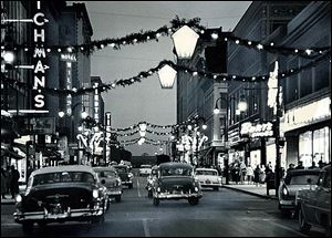 A bright downtown Toledo was a festive place for holiday shoppers in past years.