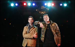 Ben Haggerty, better known by his stage name Macklemore, right, and his producer Ryan Lewis pose for a portrait at Irving Plaza in New York. 