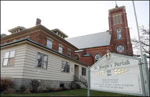 Former rectory next to St. Joseph's Church in Maumee. The church has received permission from the city to demolish the building. The church plans to replace it with an Adoration Chapel.