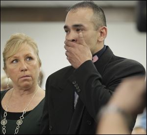 Henry Serrano, brother of Veronica and uncle of Timothy, gives a victim impact statement on behalf of himself and the family. Angie Overton, with victim assistance, is at left. 