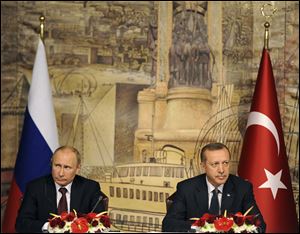 Russian President Vladimir Putin, left, and Turkey's Prime Minister Recep Tayyip Erdogan attend a joint news conference after their talks in Istanbul, Turkey.