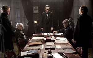 DreamWorks and Twentieth Century Fox shows, Daniel Day-Lewis, center rear, as Abraham Lincoln, in a scene from the film, 