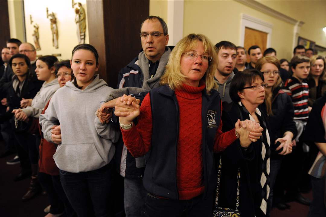 Mourners-gather-inside-the-St-Rose-of-Lima-Roman-Catholic