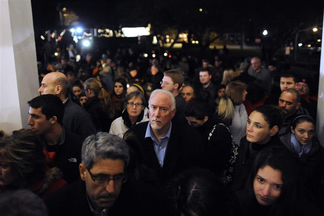 Mourners-gather-outside-a-vigil-service