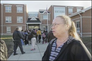 Avis Williams of Toledo, waiting outside Sherman Elementary to pick up her 5-year-old grandchild, says she doesn't worry too much about  the child's safety at school. But, she added, ‘You can't control people.'