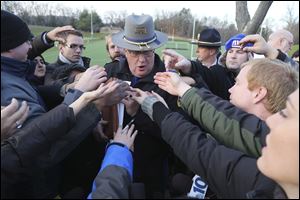 Lt. J. Paul Vance of the Connecticut State Police is surrounded by reporters as he hands out the list of victims of the shooting at the Sandy Hook Elementary School,  Saturday, in Newtown, Conn.