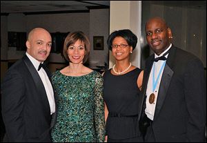 Pariss Coleman and his wife Dr. Traci Watkins, with Kelli Winston and her husband Boule president Thomas Winston at the Alpha Phi Boule Christmas party at Bradywine Country Club.