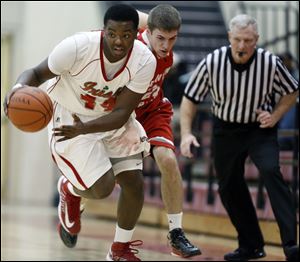 Central Catholic's Keith Towbridge steals the ball from Bowling Green's Evan Gardner. Towbridge had 16 points as the Irish improved to 4-0.