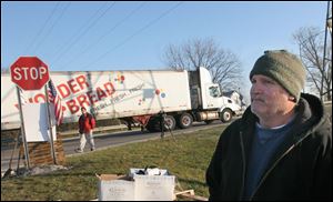 Robert Misamore stands at what is left of the picket line at the Hostess plant in Northwood. The Irving, Texas, company said a nationwide strike crippled its ability to make and deliver its products. The firm went into liquidation, and 250 local workers were among those who lost their jobs.