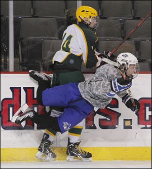 Clay’s Andrew Sterling, 14, levels Anthony Wayne's Chris Miller.