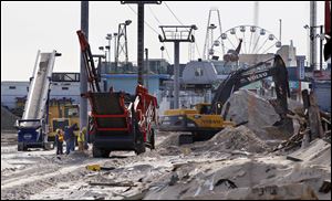 Crews work work to replace the Superstorm Sandy destroyed boardwalk in Seaside Heights, N.J., Thursday. 