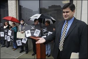 Toledo City Council president Joe McNamara speaks during a demonstration by progressives recently in downtown. McNamara and District 3 Councilman Mike Craig bucked the Democratic Party and voted for former Mayor Jack Ford for the at-large seat on council vacancy.