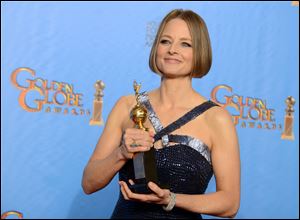 Jodie Foster poses with the Cecile B. DeMille Award for outstanding contribution to the entertainment field backstage at the 70th Annual Golden Globe Awards on Sunday in Beverly Hills, Calif.