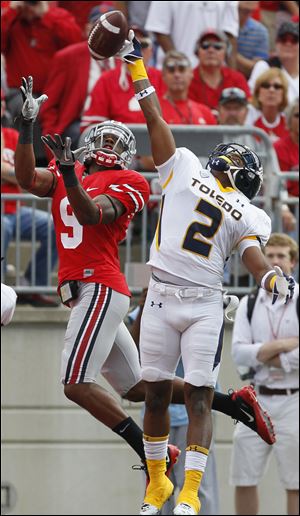 Toledo cornerback Taikwon Paige (2) bats down a pass intended for Ohio State wide receiver Verlon Reed (9)  during a 2011 game in Columbus.