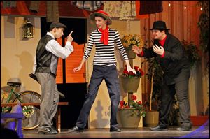 Daniel Fox, 15, left, Andrew Sabovik, 15, center, and Brandon Goldsmith, 17, right, run through a dress rehearsal of ‘Scapino!’ at Rossford High School. The comedy brought in more than $2,000 in ticket sales.