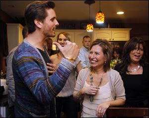 Scott Disick, left, who appears on the E! network television show Keeping up with the Kardashians, was in Monclova Township today at the home of Josie Langsdorf, right, a mother of two who is battling terminal cancer.