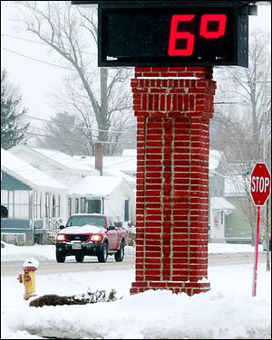 The thermometer on the Andover Bank in Austinburg Township east of Cleveland reflects the wave of arctic air that swept in from Canada Saturday night.