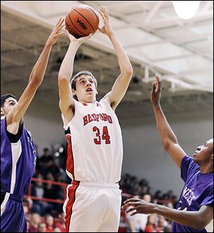 Bedford's Reed Nagley takes a shot against Pioneer's Jibreel Hussein (23) and Forrest Neal. The Mules are now 9-0.