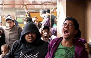 Families and supporters of those accused of soccer violence from the Port Said soccer club react to the announcement of verdicts for 21 fans on trial in last year's Port Said stadium incident which left 74 people dead, in Port Said, Egypt.