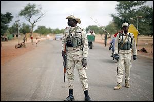 Soldiers patrol about 385 miles north of Mali's capital, Bamako.  French and Malian troops on Sunday held a bridge and airport in the town of Gao.