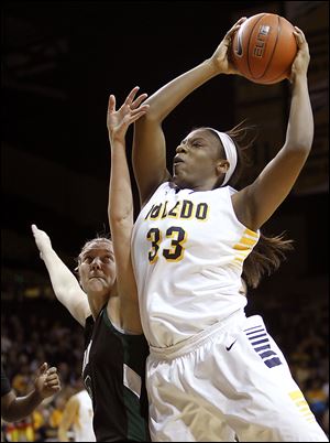 Yolanda Richardson grabs a rebound against Ohio University player Erin Bailes during the first half at Savage Arena. Richardson, who snagged six rebounds, scored a team-high15 points.