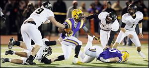 Avon's Ross Douglas (21) is expected to sign his National Letter of Intent with Michigan today and play as a defensive back.