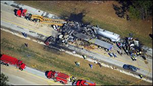 Emergency workers and firemen are at he scene of a pile up today on Interstate 16 near Jeffersonville, Ga.