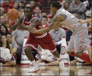 Indiana's Victor Oladipo, left, grabs a loose ball away from Ohio State's Lenzelle Smith. Oladipo scored a career-high 26 points.