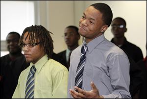 Seniors Bryan Pinkney, left, and Bryson Collins were among the students who defended Scott High School on Tuesday. They raved about the television broadcasting studio at Scott.