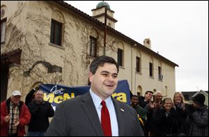 Supporters cheer as Joe McNamara, president of Toledo City Council, announces his mayoral candidacy in front of closed Fire Station No. 3.