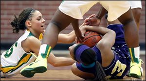 Start's Chelsie Randolph, left, battles Waite's Taylor for a loose ball. The Spartans got back in the game with their pressure defense.