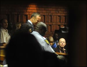 South African athlete Oscar Pistorius reacts,  in court in Pretoria, South Africa, at his bail hearing in the murder case of his girlfriend Reeva Steenkamp.